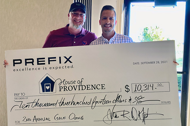 Golf fundraiser check to House of Providence
